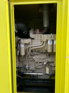 a yellow truck with a large engine and a large engine