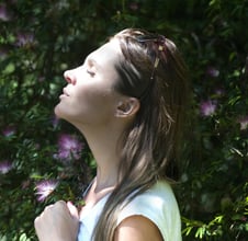 a woman with a white shirt and a white shirt respirating fresh air