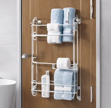 a bathroom with a towel rack and towels