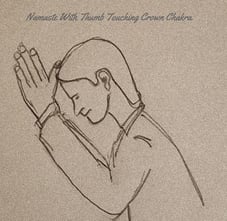 Namaste With Thumbs Touching Crown Chakra