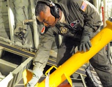 Master Sgt Troy Bickham launching AXBT during  Hurricane Iselle off Hawaii 7Aug2014. Photo USAF Master Sgt Jessica Kendziorek