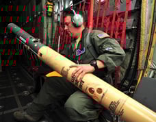 Loadmaster Tech. Sgt. Christopher Becvar (USAF) readies AXBT for Dorian remnants 29July2013. Photo: Tech. Sgt. Ryan Labadens.