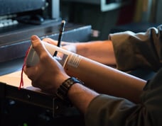 USAF personel reviews dropsonde onboard aircraft.