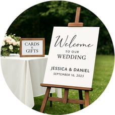 a wedding sign board with a welcome sign on it