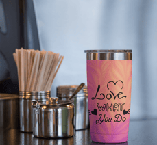 Pink tumbler with 'Love What You Do' quote – POD mockup
