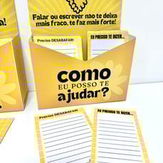 Caixinha do Desabafo amarelo com espaço para desabafos e mensagens. Cartões escritos 'Preciso desabafar' e 'Eu preciso te diz