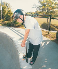 a kid about to skateboard