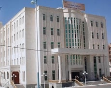 a large white building with a large white building in the background