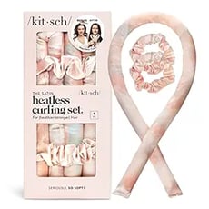 a kit with a pink ribbon tied to a ribbon