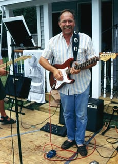 William jams on guitar