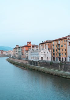Arno River in Pisa - Italy - the Gothic Santa Maria della Spina Church prominent on the right bank