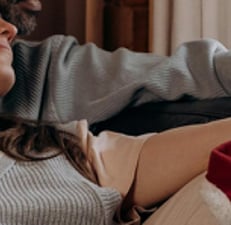 a man and woman sitting on a couch