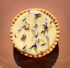 a pie with flowers on a plate