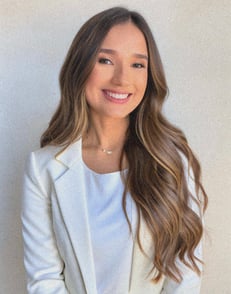 a woman in a white jacket and a white shirt
