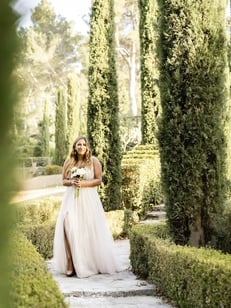 Bride walking down the aisle of a French garden for her Provence elopement ceremony