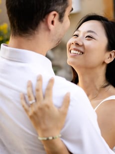 Provence engagement photographer — woman gazing into her partner’s eyes while embracing