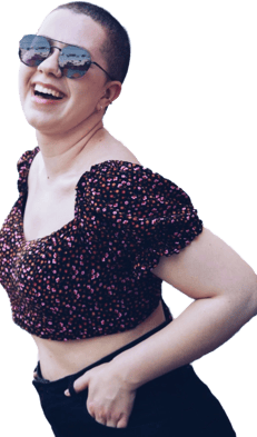 a woman in a cropped top and sunglasses