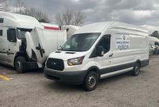Mobile diesel mechanic performing engine repairs on Freightliner truck