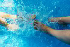 feet splashing in water