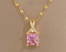 a pink princess cut diamond necklace with a pink and gold necklace
