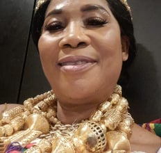 a woman in a gold necklace and a gold necklace