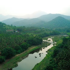 a river with rocks and rocks in the foreground