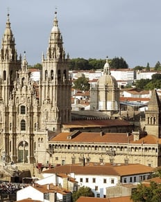 Santiago de Compostela. a large cathedral style church with a steeple tower