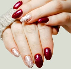 a woman's hands with a manicure and gellish