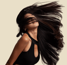 a woman with long hair and a black dress