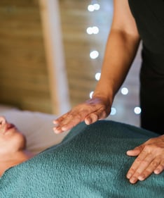 a woman is shown in a massage room