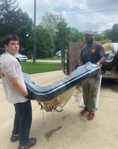 TWO RAMS JUNK REMOVAL CARRYINGA HOT-TUB FOR A HOT-TUB REMOVAL IN SUNBURY OHIO