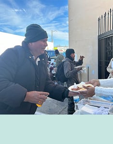 Man thankfully receiving a meal