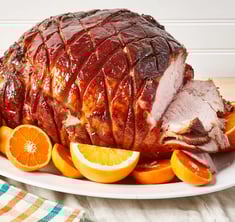 Glazzed honey ham for easter with orange slices