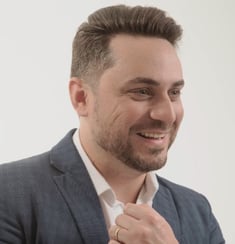 a man in a suit and a watch