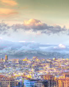 Madrid. a city skyline with a mountain in the background