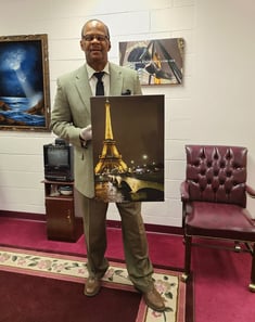 Art collector holding Summer Romance art.