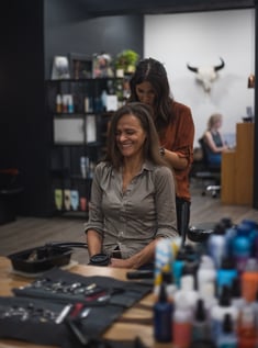 Bride getting hair done at the trademark hair company