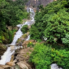 Rawana Waterfall near Ella, Sri Lanka, cascading down rocky cliffs surrounded by lush greenery