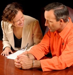 a man and woman sitting at a table