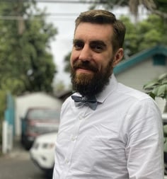 a man with a beard and a bow tie