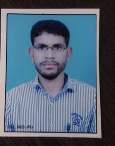 a man in a striped shirt and glasses