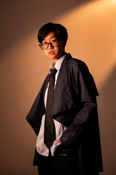 Headshot of a young Asian male model, cosplaying some Harry Potter character