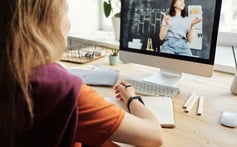 Student attending live online tuition class from home