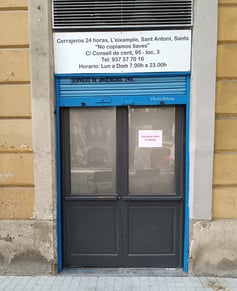 a blue door with a sign that says,