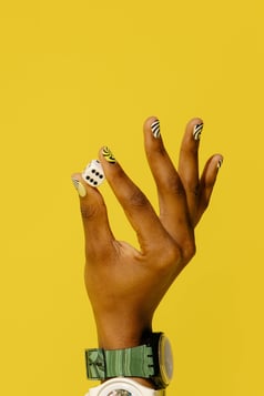 a person holding a dice