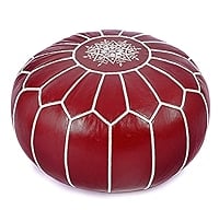 a red pouffe with white stripes on it