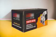 Corrugated folding carton for starter motor
