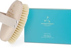 a brush brush with a wooden brush on top of it