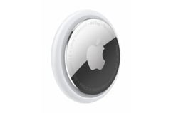 a round mirror with a white apple logo