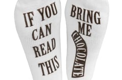 a pair of socks with the words, if you can't read this,